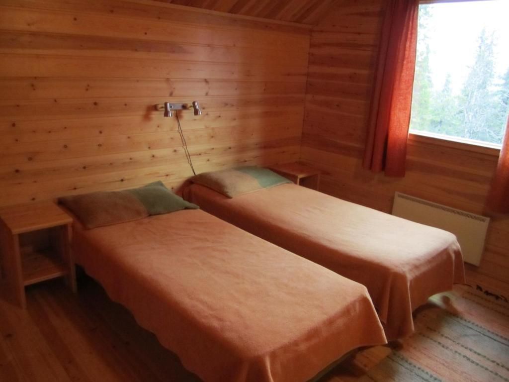 Дома для отпуска Rukajärven Kelopirtit Cottages Рука